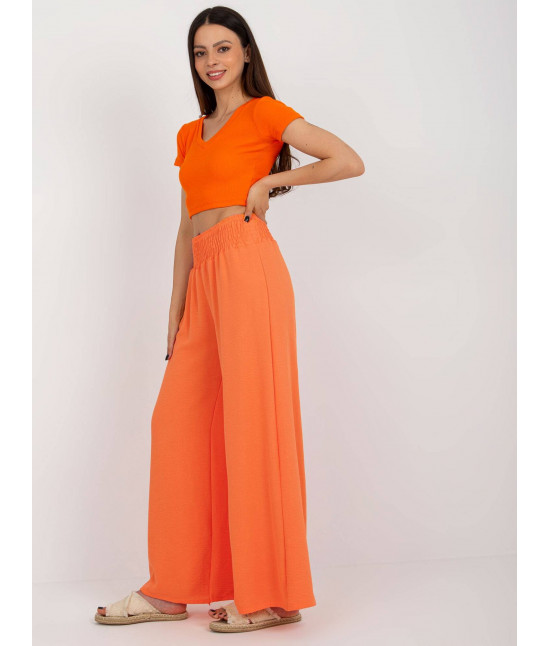 Szerokie spodnie damskie w gumę pomarańczowe (8390)